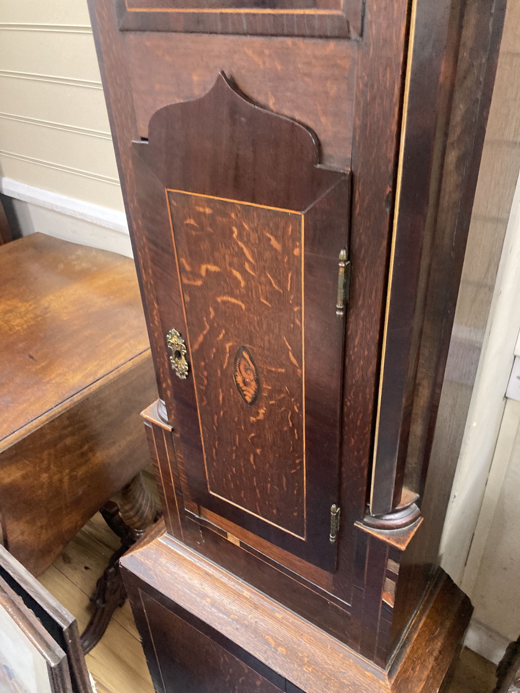 Joseph Humm[ell] of Peterborough. An early 19th century inlaid mahogany and oak eight day longcase clock, height 216cm